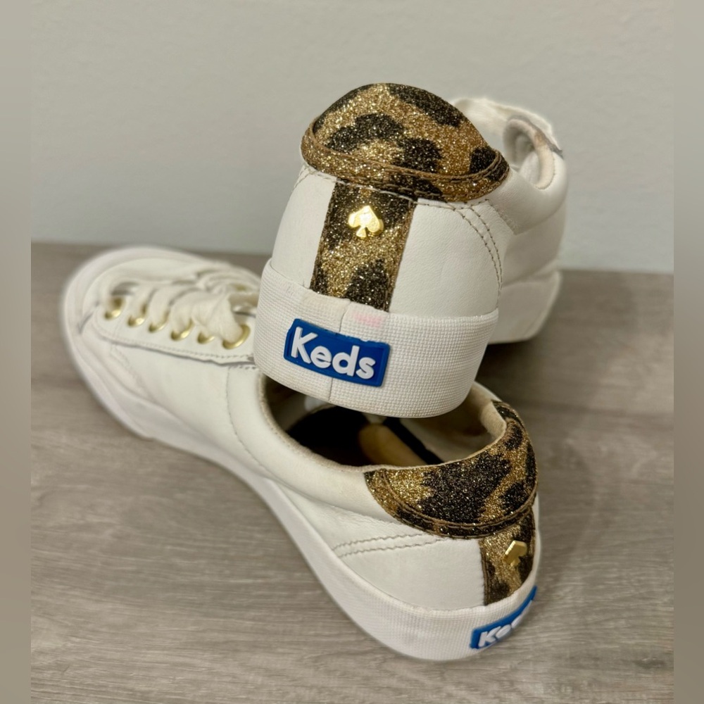 Kate Spade New York sneakers. Size 6. White, leather. Shiny back with animal